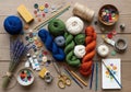 Scissors, thread spools, and sewing tools complement a palette of paint Royalty Free Stock Photo