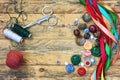 Scissors, thread, variety buttons, multicolored ribbons