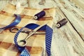 Scissors, threads, fabric and blue tape