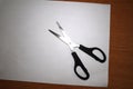 Scissors on a white sheet of paper Royalty Free Stock Photo