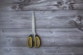 Scissors with a yellow handle closed Royalty Free Stock Photo