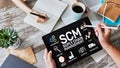 SCM - Supply Chain Management and business strategy concept on the screen. Royalty Free Stock Photo