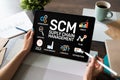 SCM - Supply Chain Management and business strategy concept on the screen. Royalty Free Stock Photo