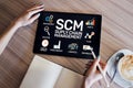 SCM - Supply Chain Management and business strategy concept on the screen. Royalty Free Stock Photo