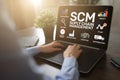 SCM - Supply Chain Management and business strategy concept on the screen. Royalty Free Stock Photo