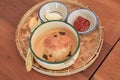 Scone with clotted cream and strawberry jam on wooden table. Homemade Freshly baked delicious Royalty Free Stock Photo