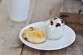 Scone , cranberry scone or scone with whipped cream and drink