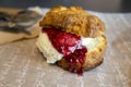 Scone full of cream and strawberry jam. Delicious Snacks High-Resolution Photos Royalty Free Stock Photo
