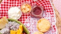 Scone, strawberry jam, almond, and mixed fruit in a basket Royalty Free Stock Photo