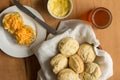 Scones, cheese and butter on wooden kitchen table - Top view photo Royalty Free Stock Photo