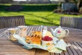 Scones with cups of tea in an English country garden. Royalty Free Stock Photo