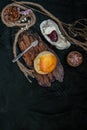 Scones on the wooden tray served with Homemade raspberry jam and Mascarpone cheese on Shell