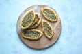 Scones with Zatar. Manakish Arabic on a wooden tray. Arabic cuisine.