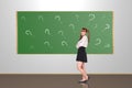 Scoolgirl in the classroom Royalty Free Stock Photo