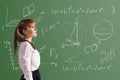 Scoolgirl in the classroom Royalty Free Stock Photo