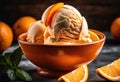 A scoop of bright orange creamsicle ice cream with orange slices on top. Royalty Free Stock Photo