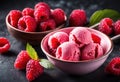 A scoop of bright pink raspberry sorbet with fresh raspberries on top