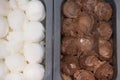 Scoop chocolate ice cream and coconut milk ice cream in box