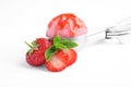 Scoop of delicious strawberry ice cream with mint, syrup and fresh berries Royalty Free Stock Photo