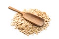Scoop and heap of raw oatmeal on white background Royalty Free Stock Photo