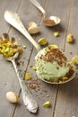 Scoop of homemade pistachio ice cream with chopped pistachios and chocolate Royalty Free Stock Photo