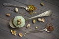 Scoop of homemade pistachio ice cream with chopped pistachios and chocolate