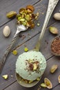 Scoop of homemade pistachio ice cream with chopped pistachios and chocolate Royalty Free Stock Photo