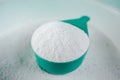 Scoop of Laundry detergent powder for washing machine Royalty Free Stock Photo