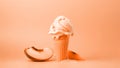 A scoop of melting vanilla ice cream in a waffle cone with a sliced fruit on peach fuzz color minimal background. Modern trendy Royalty Free Stock Photo