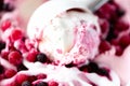 Scoop of pink ice cream with frosen berries. Summer food concept, copy space, top view. Sweet yogurt dessert or berries