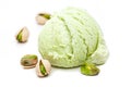 A scoop of pistachio ice cream with pistachios isolated on white background