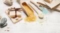 Scoop of sea salt, bars of handmade soap, stones and towels Royalty Free Stock Photo