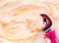 Scoop Serving Orange and Yellow Swirled Ice Cream Royalty Free Stock Photo