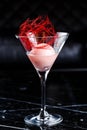 Scoop of the strawberry ice cream in martini glass