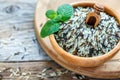 Scoop in a wooden bowl with mixture of wild and white rice. Royalty Free Stock Photo