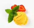 Scoop of yellow sorbet Royalty Free Stock Photo