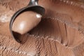 Scooping chocolate ice cream close up shot