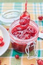Scooping gooseberry jam jar spoon