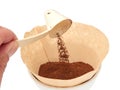 Scooping grinded coffee in a filter Royalty Free Stock Photo