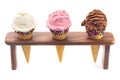 Scoops Classic Vanilla Strawberry and Chocolate Ice Cream Flavors in Sugar Cones with Sprinkles Royalty Free Stock Photo