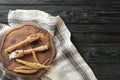 Scoops with flour, wheat grains and spikelets on wooden background Royalty Free Stock Photo