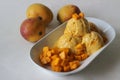 Scoops of Home made mango ice cream served with fresh cut Lalbagh mangoes Royalty Free Stock Photo