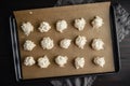 Scoops of Macaroon Batter on a Parchment LIned Sheet Pan Royalty Free Stock Photo