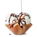 scoops vanilla ice cream pouring chocolate glaze in waffle cone bowl isolated on white