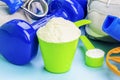 Scoops with whey protein and creatine with sport items around Royalty Free Stock Photo