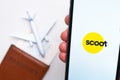 Scoot Airlines mobile app. A convenient mobile application for buying tickets using smartphone with plane, passport and