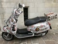 Scooter covered in pictures of beer bottles. Bruges, Belgium. June 15, 2018. Royalty Free Stock Photo