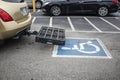 Scooter Lift - Wheelchair Carrier for Car in handicapped parking space in parking lot Royalty Free Stock Photo