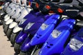 Scooter motorbikes in a row with perspective Royalty Free Stock Photo