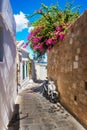 Scooter parked on narrow street of Lindos Rhodes, Greece Royalty Free Stock Photo